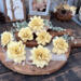 Garden inspired faux wood flower blossoms hand painted in a custom dusty yellow. 